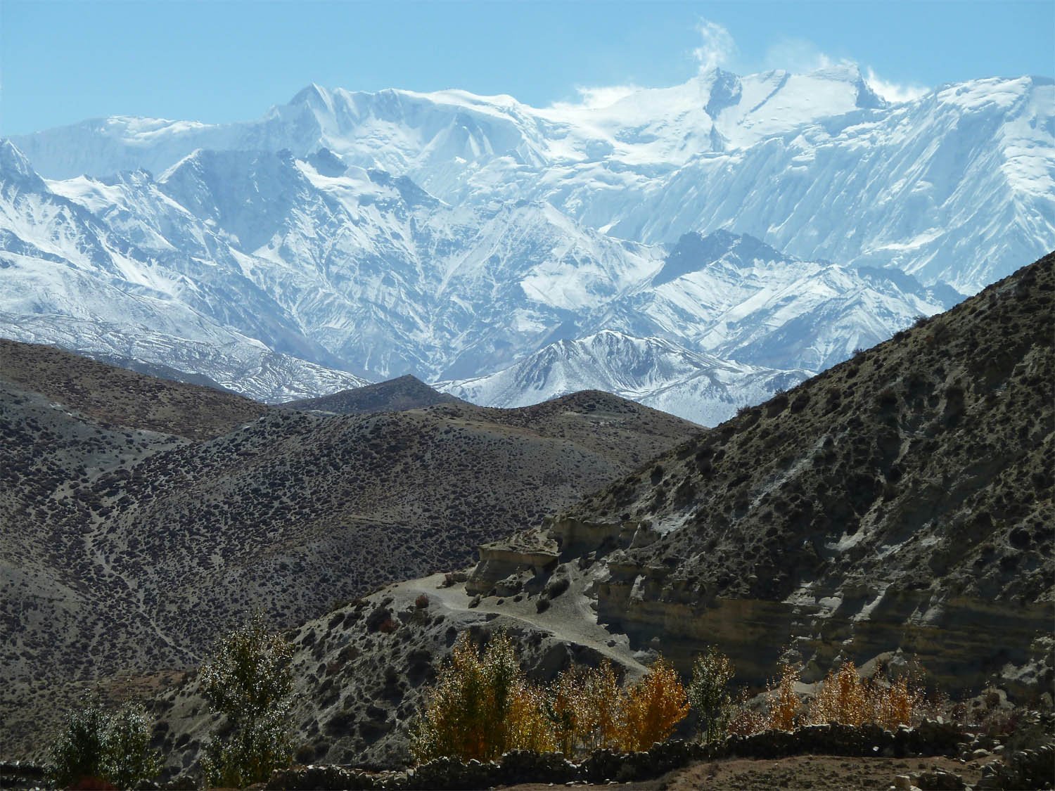 Trekking enthusiast with backpack hiking through Himalayan trails in Nepal